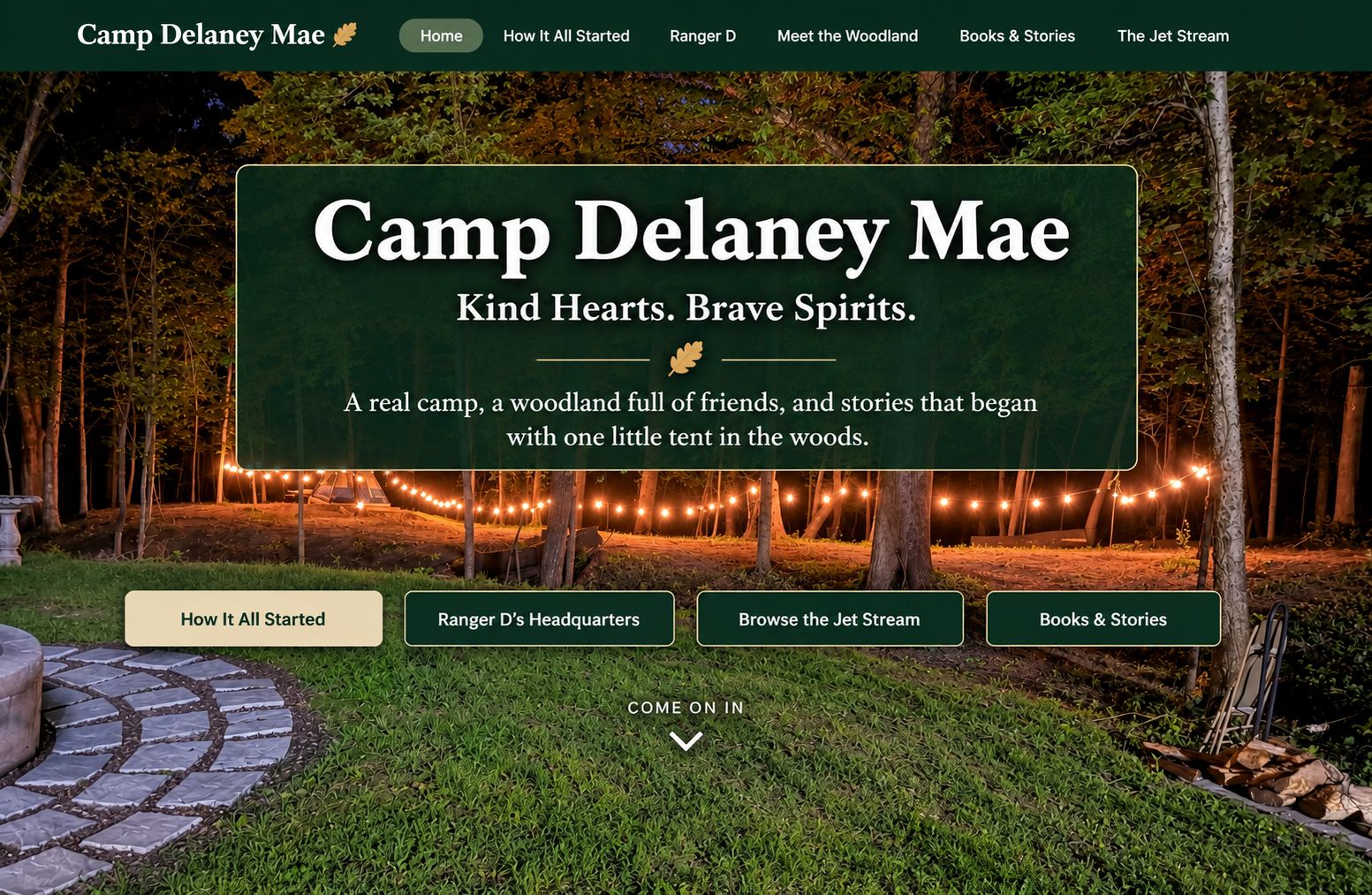 Camp Delaney Mae nighttime welcome banner
